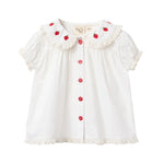 Front view of Floess Aja Blouse in white featuring strawberry embroidered Peter Pan collar and puff sleeves with lace trim.