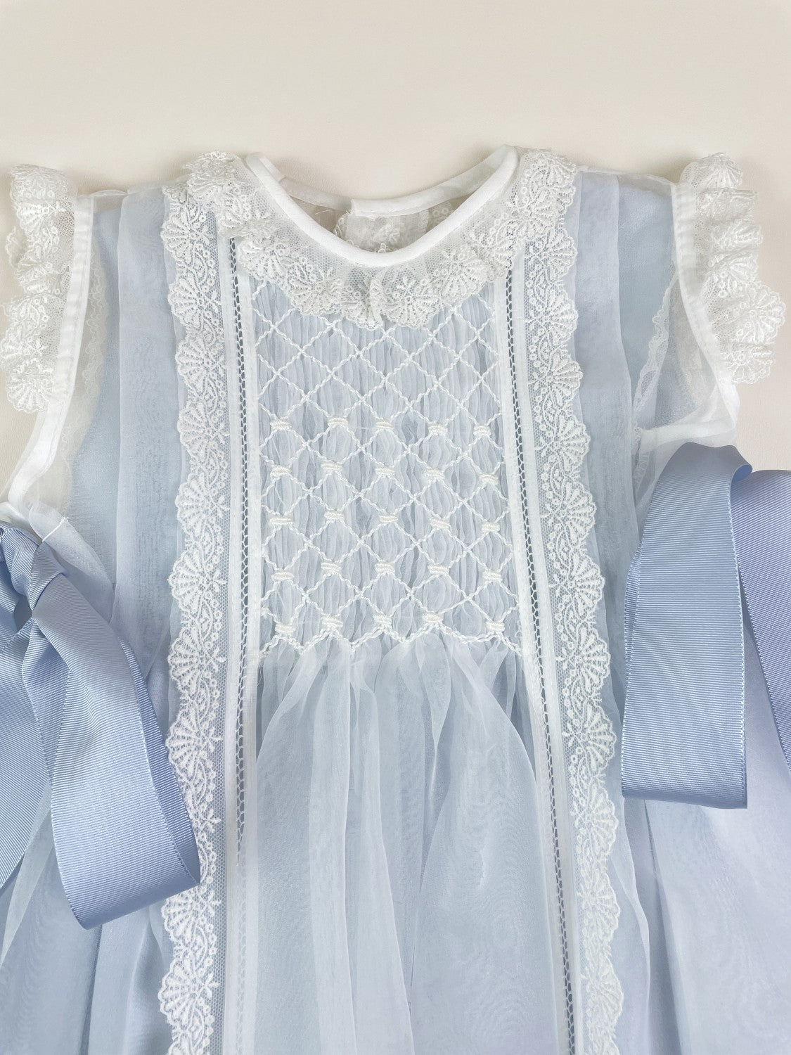 Luxe Crystal 2-Piece Handsmocked Blue Baby Dress White- Blue Lining/Bow's Beige / 24M Luxe Crystal 2-Piece Handsmocked Blue Baby Dress White- Blue Lining/Bow's Beige / 24M
