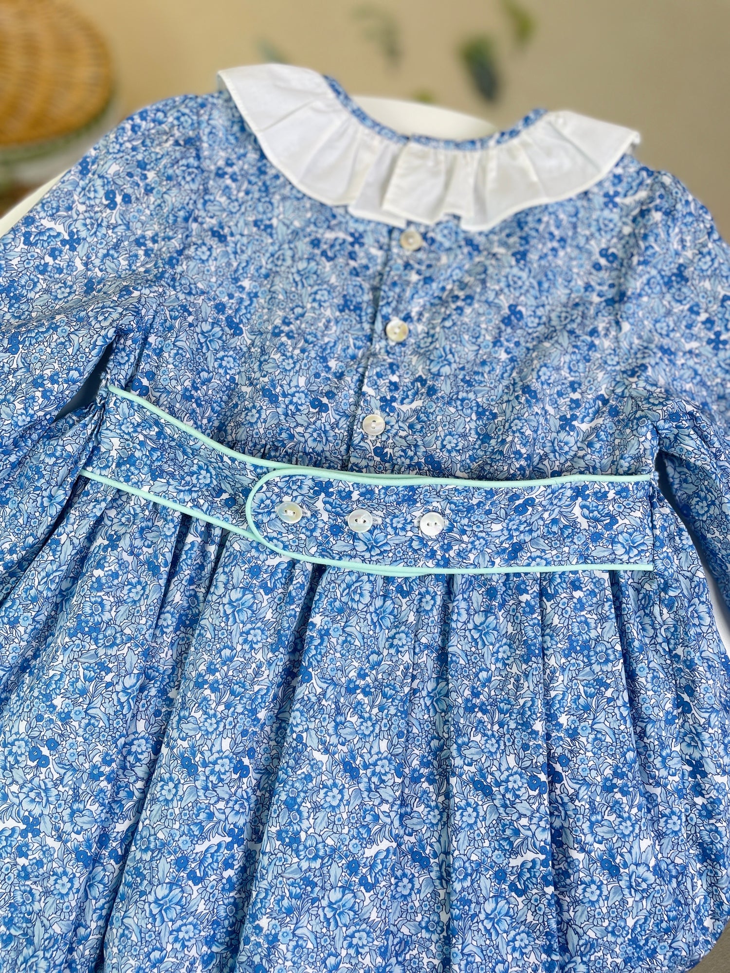 Smocked Girl's blue floral long sleeved dress