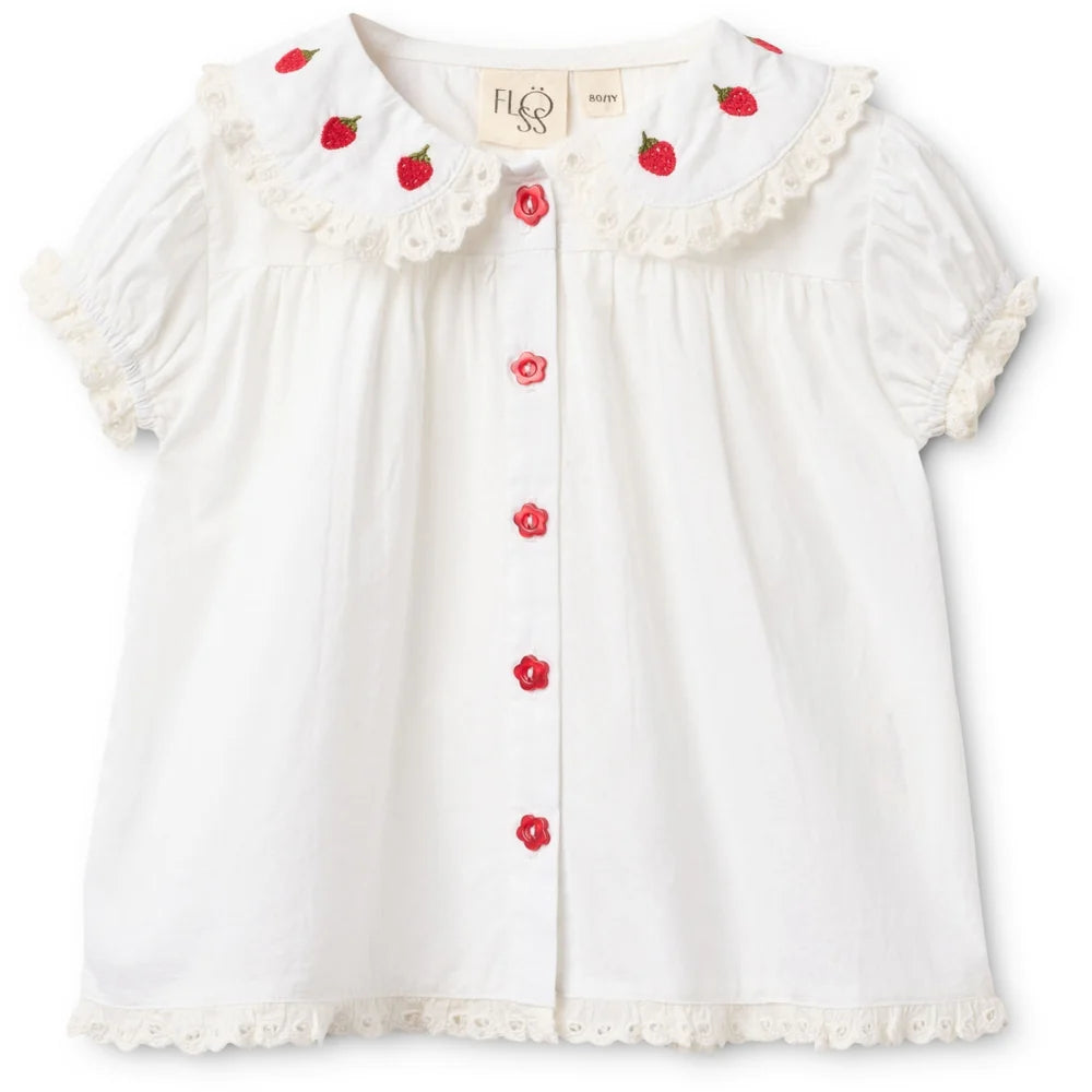 Front view of Floess Aja Blouse in white featuring strawberry embroidered Peter Pan collar and puff sleeves with lace trim.