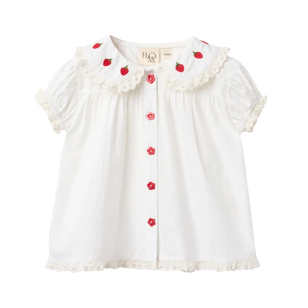 Front view of Floess Aja Blouse in white featuring strawberry embroidered Peter Pan collar and puff sleeves with lace trim.