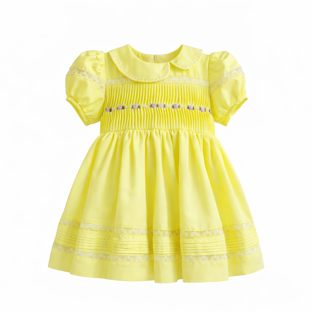lemon yellow baby girl dress with pintuck bodice and lace hem on hanger